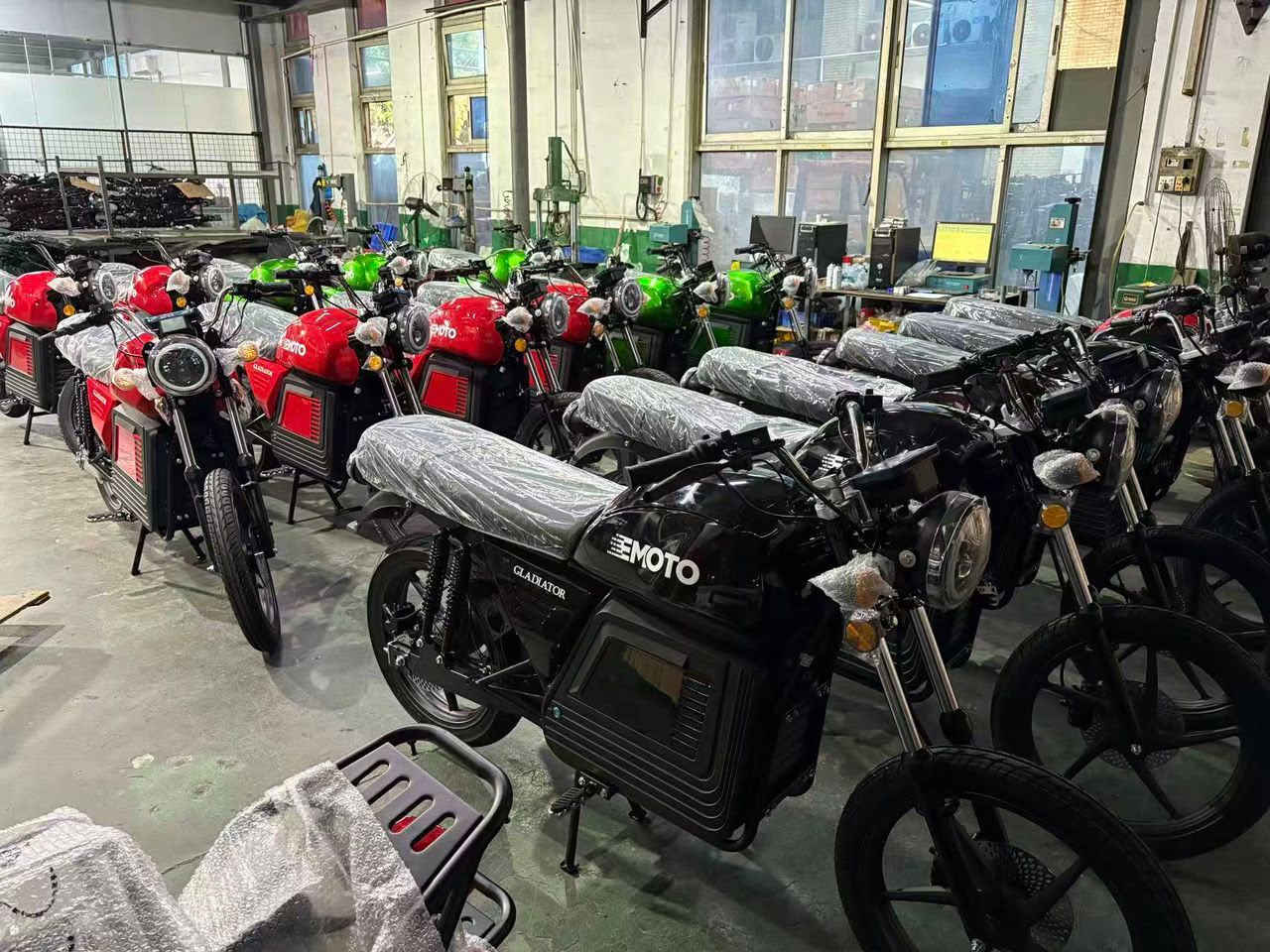 EMoto fleet management — motorcycles lined up for a logistics operation